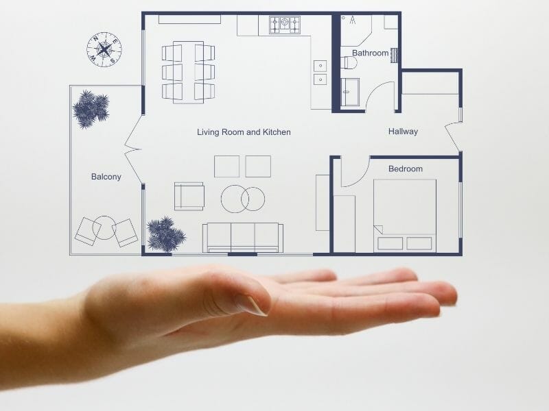 Blue 2d floor plan with hand